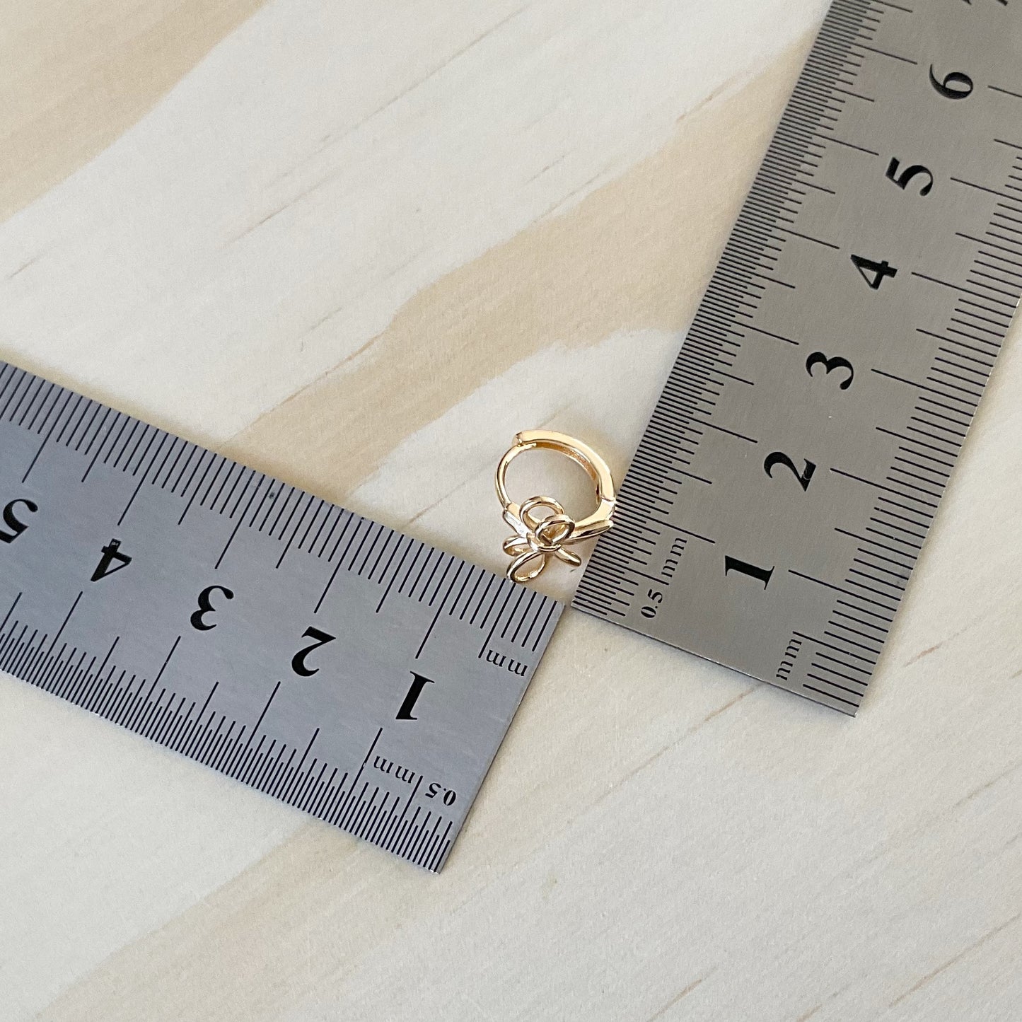 Gold Huggie Hoops - Tied In A Bow
